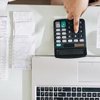 a bookkeeper going over receipts and analysing finances